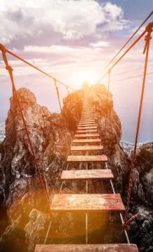 Suspension bridge on the Mount. path to the light Stock Photos