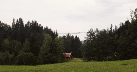 Suspension bridge in the mountains in summer. Stock Footage 103724687