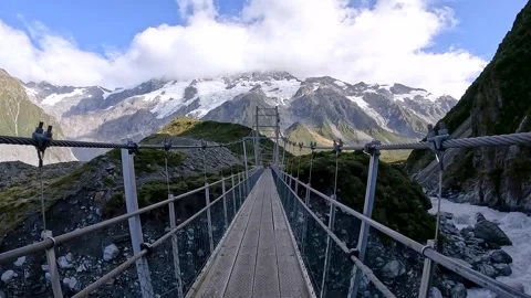 Suspension Bridge Over Hooker River in Mount Cook National Park  Alpine Hik.. Stock Footage 295010377