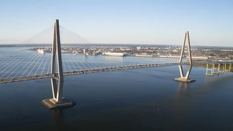 Suspension bridge over the river overlooking the city Stock Footage 96377209