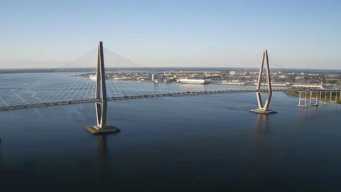 Suspension bridge over the river overlooking the city Stock Footage 96377456