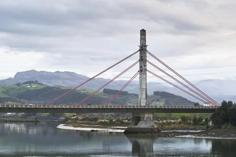 Suspension bridge over the river. Stock Photos