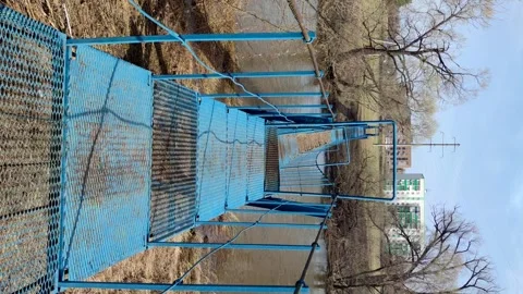 Suspension bridge over spring river Stock Footage 282814553