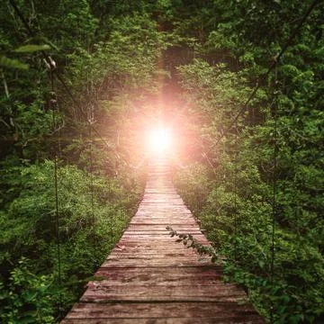 Suspension bridge. path to the light Stock Photos