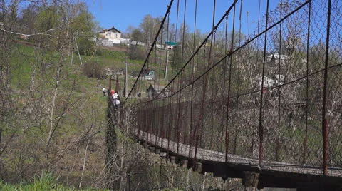 Suspension bridge shaking while people walking. Stock Footage 23075678