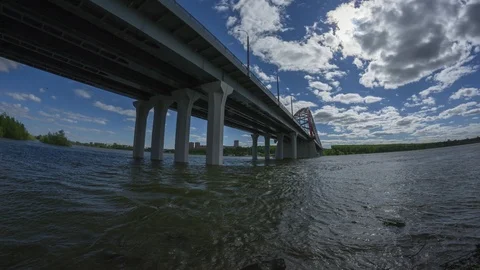 Suspension Bridge time lapse clouds in blue sky, sun is shining Stock Footage 87039718