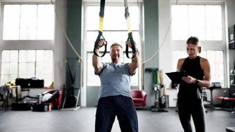 Suspension Training Workout. Sport Exercise In Gym Stock Footage 288565077