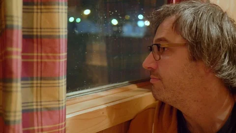 Suspicious Man Looking Out The Window at Night 스톡 동영상 102611227