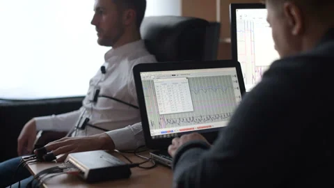 Suspicious man passes lie detector in the office. Asking questions Stock Footage 307308007
