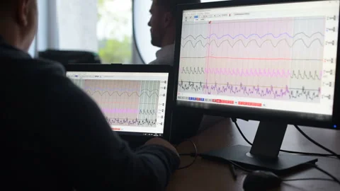 Suspicious man passes lie detector in the office. Asking questions Stock Footage 307308308