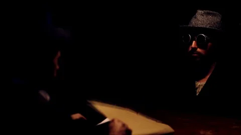 Suspicious man questioned by detectives in interrogation room Stock Footage 120364928