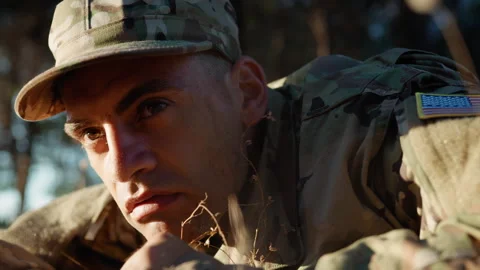 Suspicious soldier lying on the ground Video stock 250766282