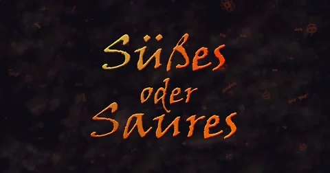 Susses oder Saures (Trick or Treat) German text dissolving into dust from bottom Stock Footage 68693344