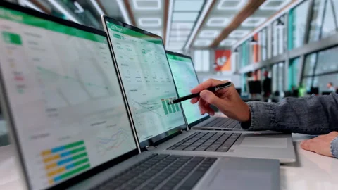 Sustainability Manager Reviews ESG Data Dashboard On Laptop Stock Footage 337227240