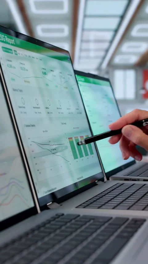 Sustainability Manager Reviews ESG Data Dashboard On Laptop Stock Footage 337637814