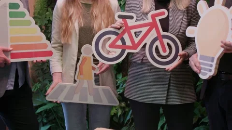 Sustainable developtment symbols held by group of people Stock Footage 237533084