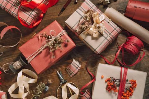 Sustainable gift wrapping flat lay, four gift boxes packed and decorated with Stock Photos