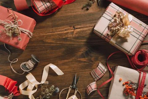 Sustainable gift wrapping flat lay, four gift boxes packed and decorated with Stock Photos