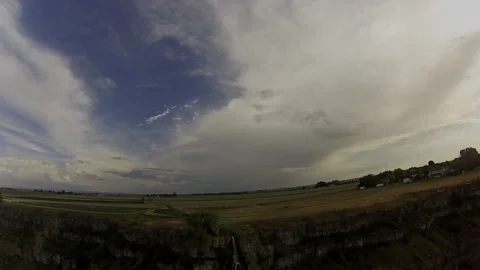 Sustained Waterfall FPV Dive: Smooth Vertical Proximity and River Track Stock Footage 331896730