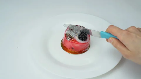 Сut in half the blackberry cake Stock Footage 125867387