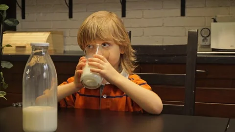 Сute child drinking milk. Stock Footage 266665651