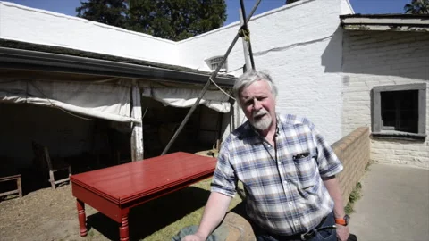 Sutter's Fort, man speaking to camera in plaza Stock Footage 166983258