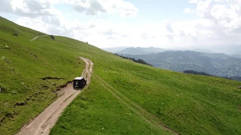 SUV Adventure in Expansive Mountain Meadows Stock Footage 254432550