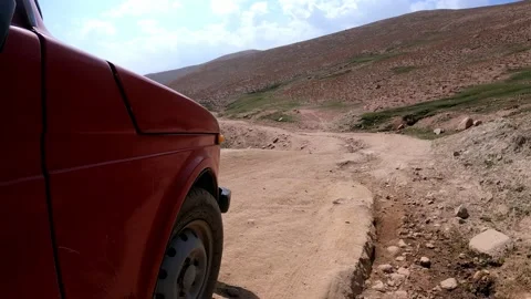 SUV a car going down from the Arashan lake on the hill Stock Footage 171071392