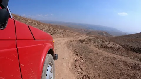 SUV a car going down from the Arashan lake on the hill Stock Footage 171071608