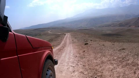 SUV a car going down from the Arashan lake on the hill Stock Footage 171074208