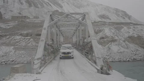 SUV Crosses Rugged Bridge in Remote Ladakh Mountains – Editorial 28th Feb 2025 Stock Footage 313326613