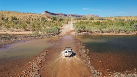 SUV crossing river Stock Footage 121842783