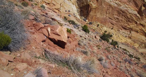 SUV descending Burr Trail Switchbacks into the colorful Strike Valley, Utah. Stock Footage 124083529