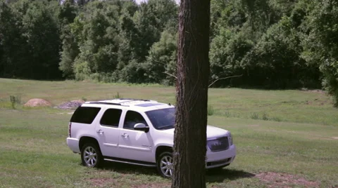 SUV Drive by tracking shot Stock Footage 44310393