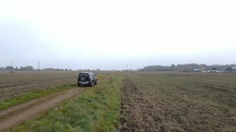 SUV driving on field Stock Footage 169341508