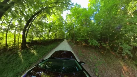 SUV driving narrow road through woods, tiny planet perspective Stock Footage 159736719