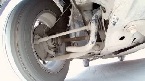 SUV driving on a road. Camera from below the car. Stock Footage 153371676