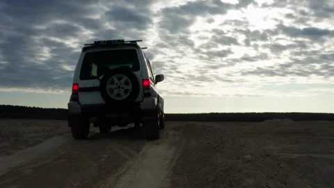 The SUV is driving on the road Stock Footage 171317262