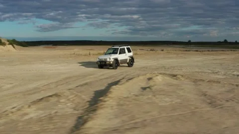 The SUV is driving on the road Stock Footage 171317862