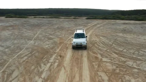 The SUV is driving on the road Stock Footage 171558936