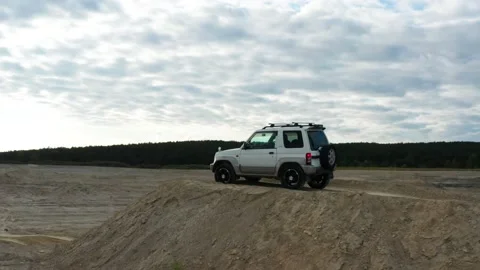The SUV is driving on the road Stock Footage 171559841
