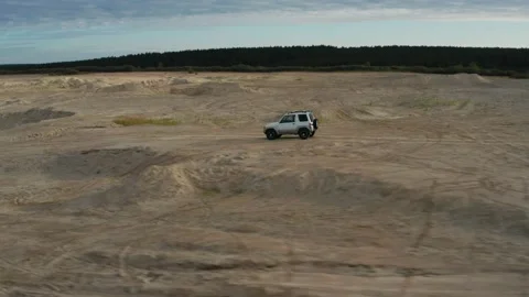 The SUV is driving on the road Stock Footage 171562964