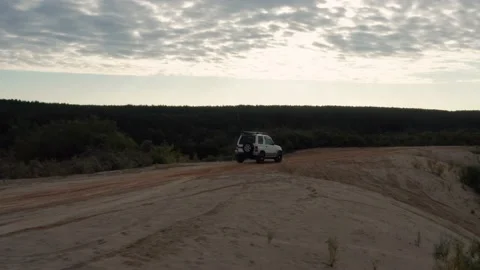 The SUV is driving on the road Stock Footage 174308886