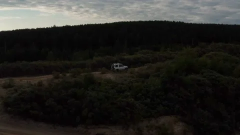 The SUV is driving on the road Stock Footage 174313865