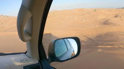 SUV driving through desert dunes seen from car window, adventure travel 스톡 동영상 329232268