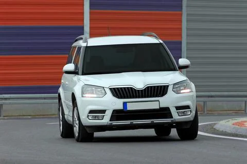 SUV driving too fast Stock Photos
