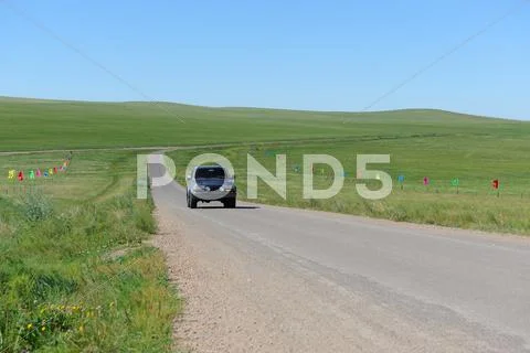 Suv in grassland Stock Photos