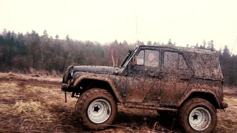 SUV in the mud. Slow motion Stock Footage 74537423