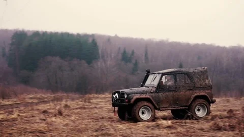 SUV in the mud. Slow motion Stock Footage 74537429