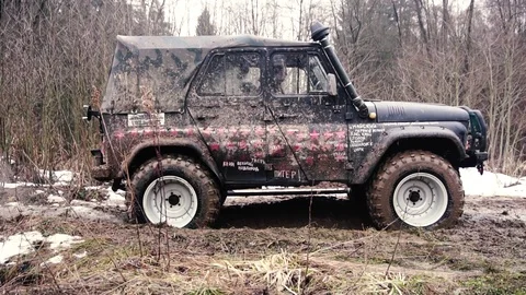 SUV in the mud. Slow motion Stock Footage 74537516